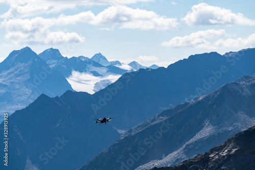 Drone flies mountains and peaks landscape in the background. Hills covered with glaciers and snow, natural environment. Hiking in the Gaislach. Ski resort in Tirol alps, Austria, Europe