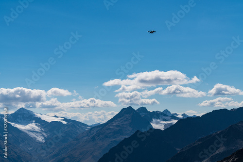 Drone flies mountains and peaks landscape in the background. Hills covered with glaciers and snow, natural environment. Hiking in the Gaislach. Ski resort in Tirol alps, Austria, Europe