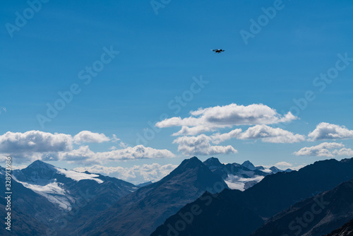 Drone flies mountains and peaks landscape in the background. Hills covered with glaciers and snow  natural environment. Hiking in the Gaislach. Ski resort in Tirol alps  Austria  Europe