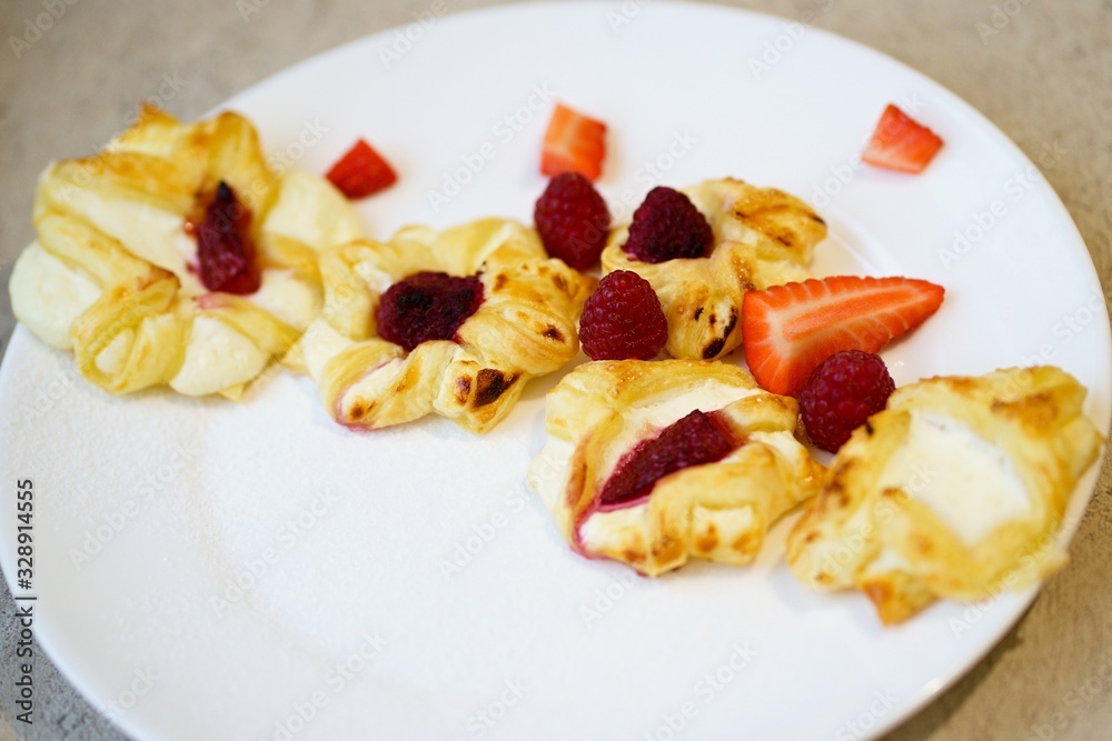 puff pastry cookies with organ and raspberries, strawberries