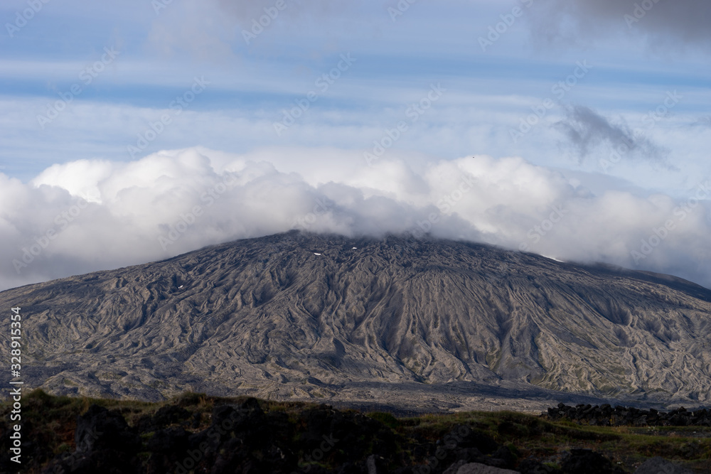 mountain of Snaefellsjokull National Park with white cloudy cap on peak. Iceland