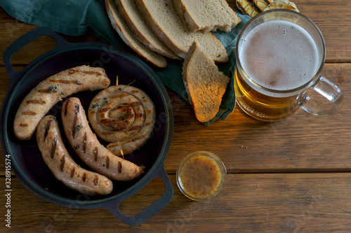 grilled sausages with a glass of beer