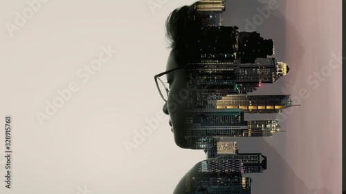 Фотография Double exposure of Asian woman silhouette and modern renewable city skyline background