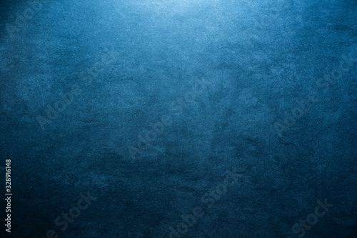 blue grunge stone background texture with radial gradient and copy space