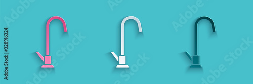 Paper cut Water tap icon isolated on blue background. Paper art style. Vector Illustration