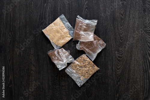 a view from above of several rice and other porridge in quick cooking plastic bags package