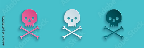 Paper cut Skull on crossbones icon isolated on blue background. Paper art style. Vector Illustration