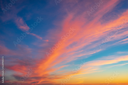 Blue sky and red clouds. Cloudy sky. Sunset colors in heaven, natural environmental background