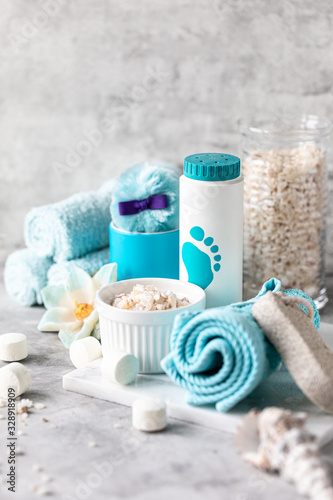 Spa accessories - sea salt  powder  tablets for a bath  pumice  cream on a light background. Healthy lifestyle concept. Cosmetics for skin care feet. Decor for the bathroom.