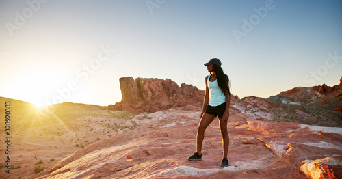 fit african american woman hiker looking out across deset at valley of fire park photo