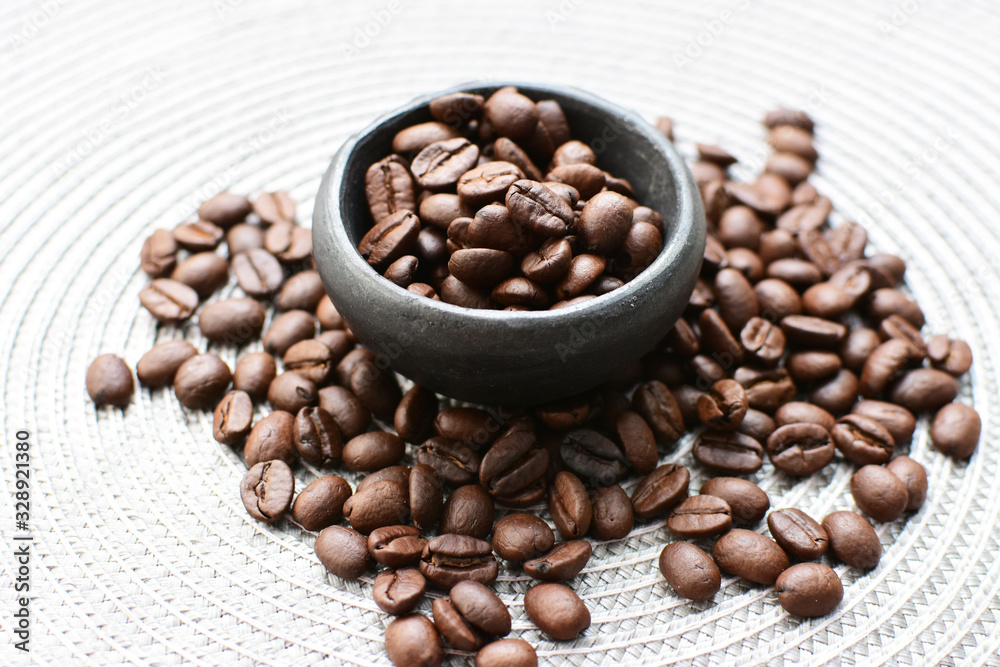 Fototapeta premium Colombian coffee beans, displayed in containers on black background