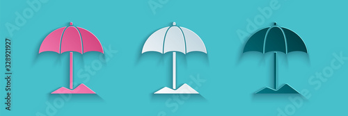 Paper cut Sun protective umbrella for beach icon isolated on blue background. Large parasol for outdoor space. Beach umbrella. Paper art style. Vector Illustration