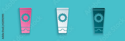 Paper cut Sunscreen cream in tube icon isolated on blue background. Protection for the skin from solar ultraviolet light. Paper art style. Vector Illustration