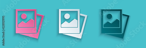 Paper cut Photo icon isolated on blue background. Paper art style. Vector Illustration