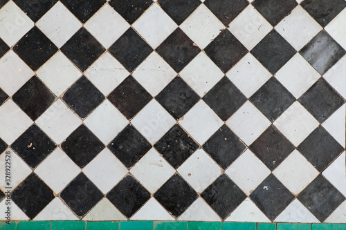 Black and white ceramic tiles in checkerboard pattern