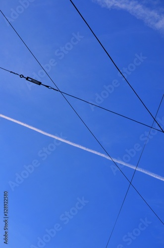 High voltage wires against blue sky © Dmitro