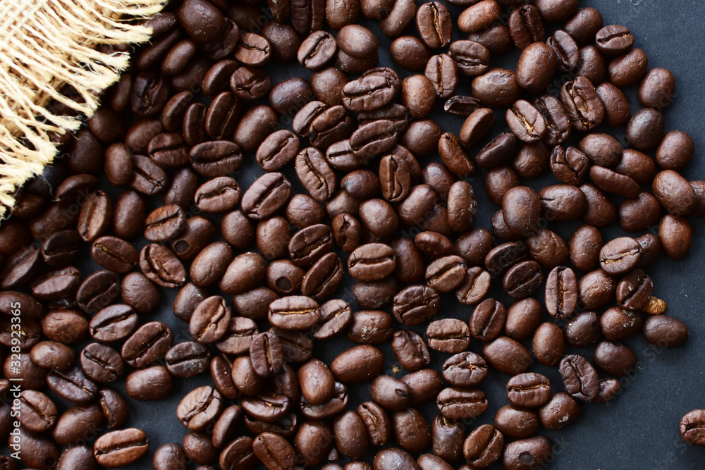 Obraz premium Colombian coffee beans, displayed in containers