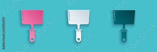 Paper cut Putty knife icon isolated on blue background. Spatula repair tool. Spackling or paint instruments. Paper art style. Vector Illustration
