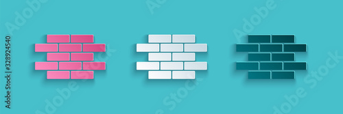 Fototapeta Paper cut Bricks icon isolated on blue background. Paper art style. Vector Illustration
