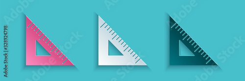 Paper cut Triangular ruler icon isolated on blue background. Straightedge symbol. Geometric symbol. Paper art style. Vector Illustration