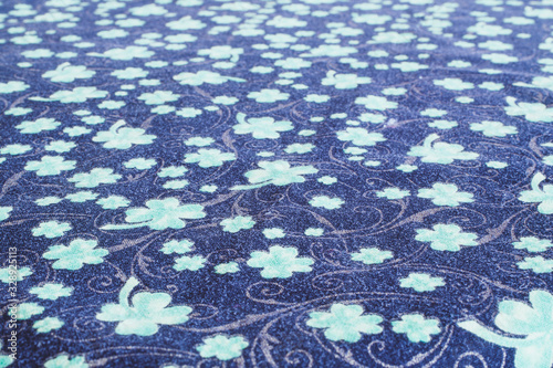 Green shamrock tablecloth texture going into distance