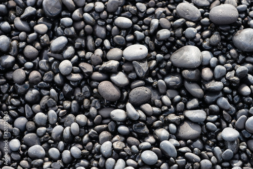 Volcanic rocks on black sand beach  Iceland