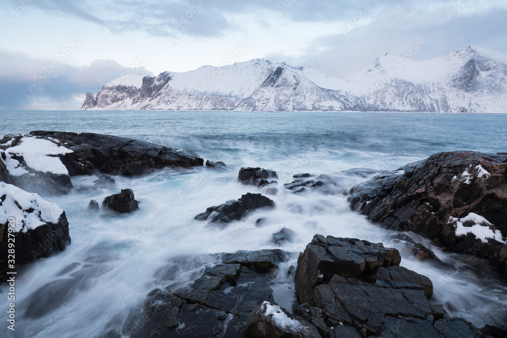 Panorama of snowy fjords and mountain range, Senja, Norway Amazing Norway nature seascape popular tourist attraction. Best famous travel locations. beautiful sunset within the amazing winter landscape Panorama of snowy fjords and mountain range, Senja, Norway Amazing Norway nature seascape popular tourist attraction. Best famous travel locations. beautiful sunset within the amazing winter landscape