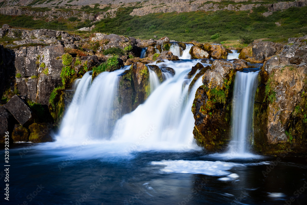 Obraz premium Iceland waterfall closeup view of the gods cliff with long exposure smooth motion of water in summer landscape