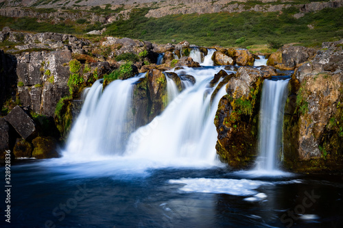 Iceland waterfall closeup view of the gods cliff with long exposure smooth motion of water in summer landscape