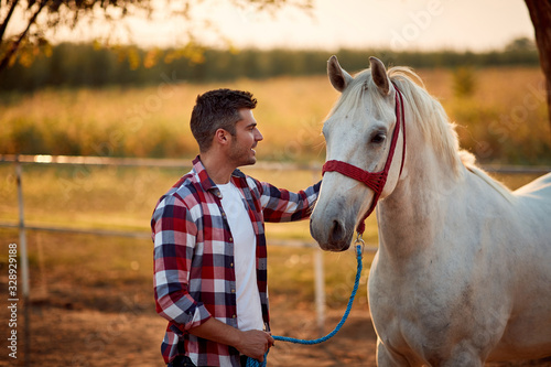 Loving tender moment between men and horse.Young man and horse.