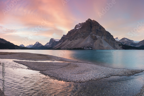 Autumn in the mountains near Bow Lake Banff National Park Alberta Canada Bow Lake panorama reflection with first snow in mountains. Waputik Range, Cascade Rocky mountains Beautiful landscape concept. photo