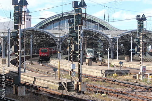 Railroad tracks with three departing trains at Cologne station