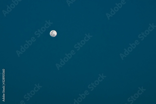 Full moon against the dark blue and black sky © asiraj