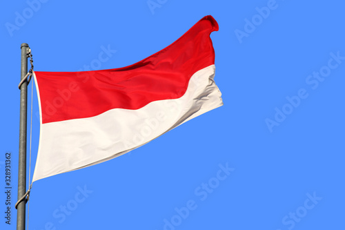 silk national flag of the modern state of Monaco  Nuremberg  Indonesia with beautiful folds waving in the wind  concept of tourism  travel  emigration  global business