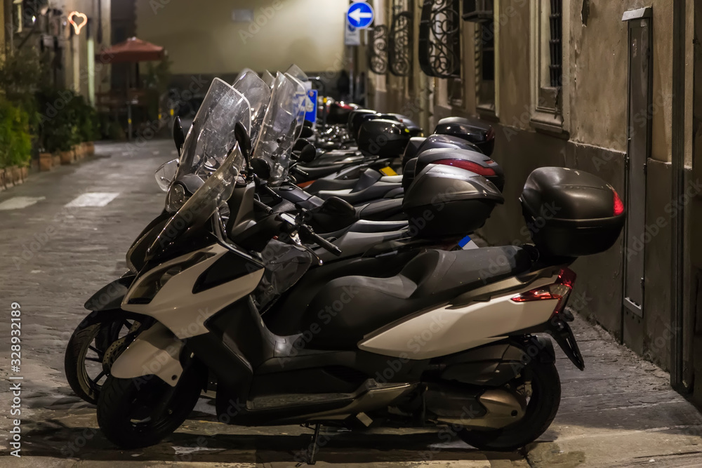 large number of parked scooters
