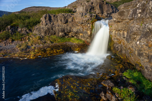 Fototapeta Naklejka Na Ścianę i Meble -  Iceland waterfall closeup view of the gods cliff with long exposure smooth motion of water in summer landscape