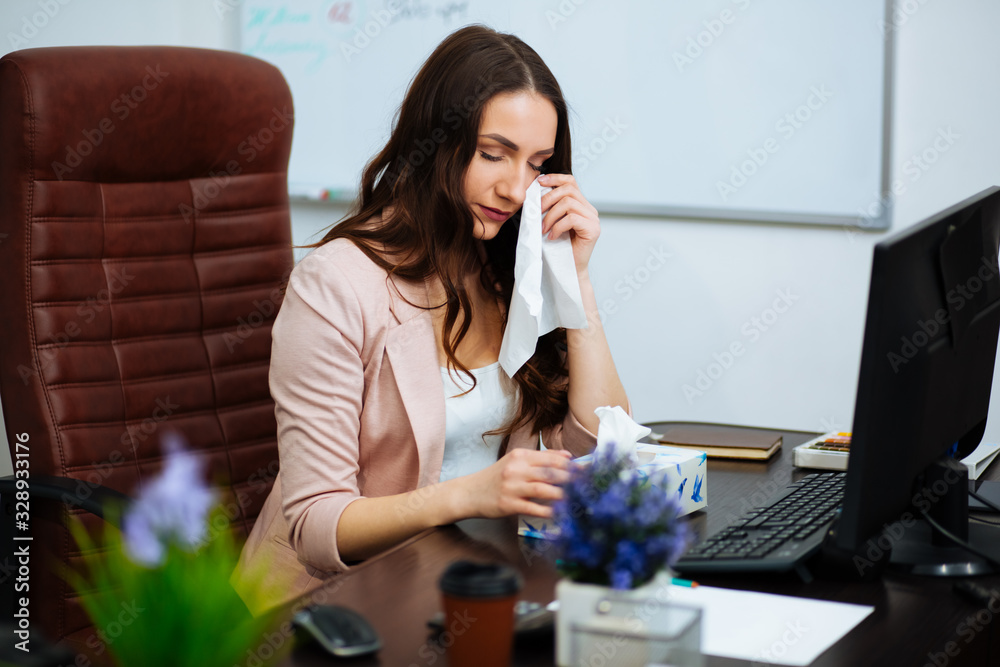 Frustrated businesswoman crying in her office Frustrated businesswoman crying in her office