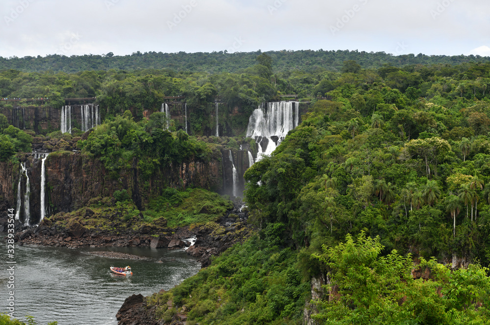 mesmerizing Iguazu Falls against the backdrop of the jungle and golkboy sky