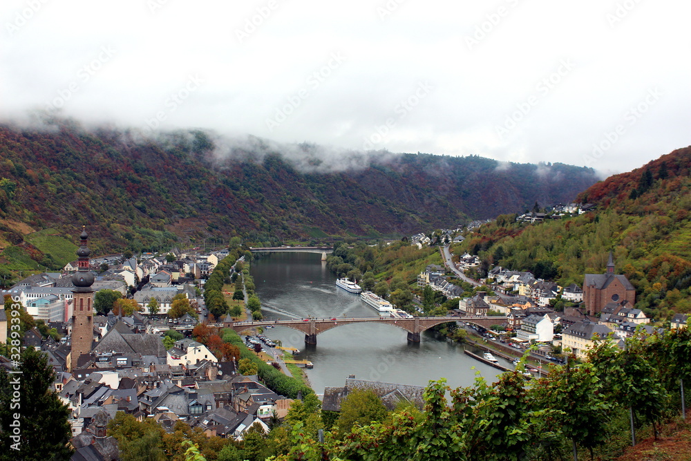 Moselle River in Cochem in Autumn with Bridges and Cruise Ships