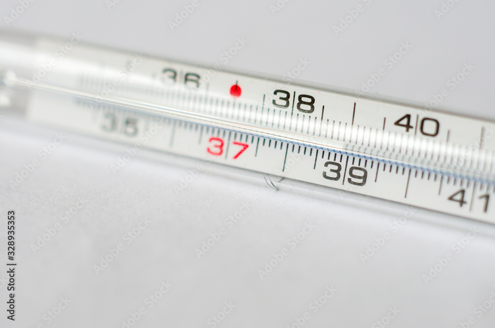 Mercury thermometer, on white background showing 39 degrees Celsius. Mercury thermometer, on white background showing 39 degrees Celsius.