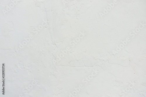 Abstract grunge white painted stucco wall texture background with copy space