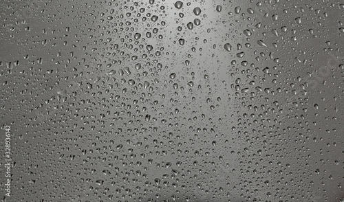 Drops of water on the glass, cloudy wether outside the window