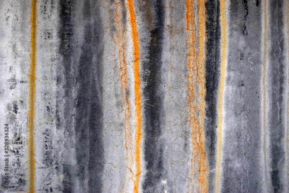 Naklejka premium Bright texture of a concrete wall with rusty streaks. Vintage effect.