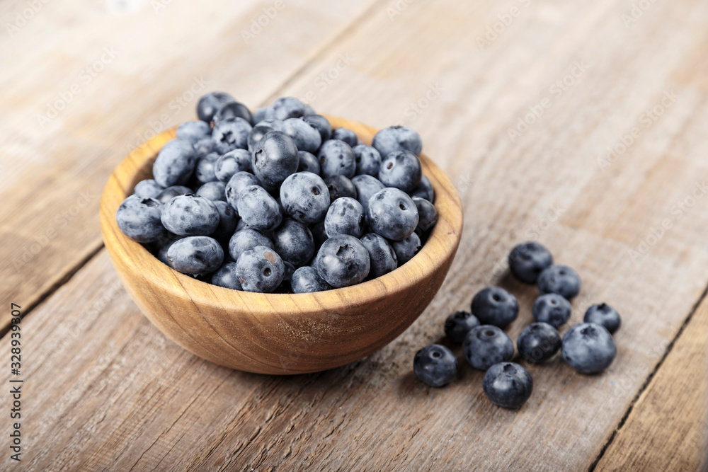 Freshly picked blueberries in wooden bowl. Blueberry antioxidant. Freshly picked blueberries in wooden bowl. Blueberry antioxidant.