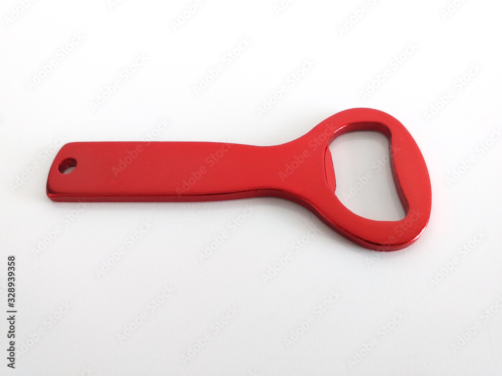 Horizontal view of red bottle opener isolated on white background. Close up of Beer opener. Horizontal view of red bottle opener isolated on white background. Close up of Beer opener.
