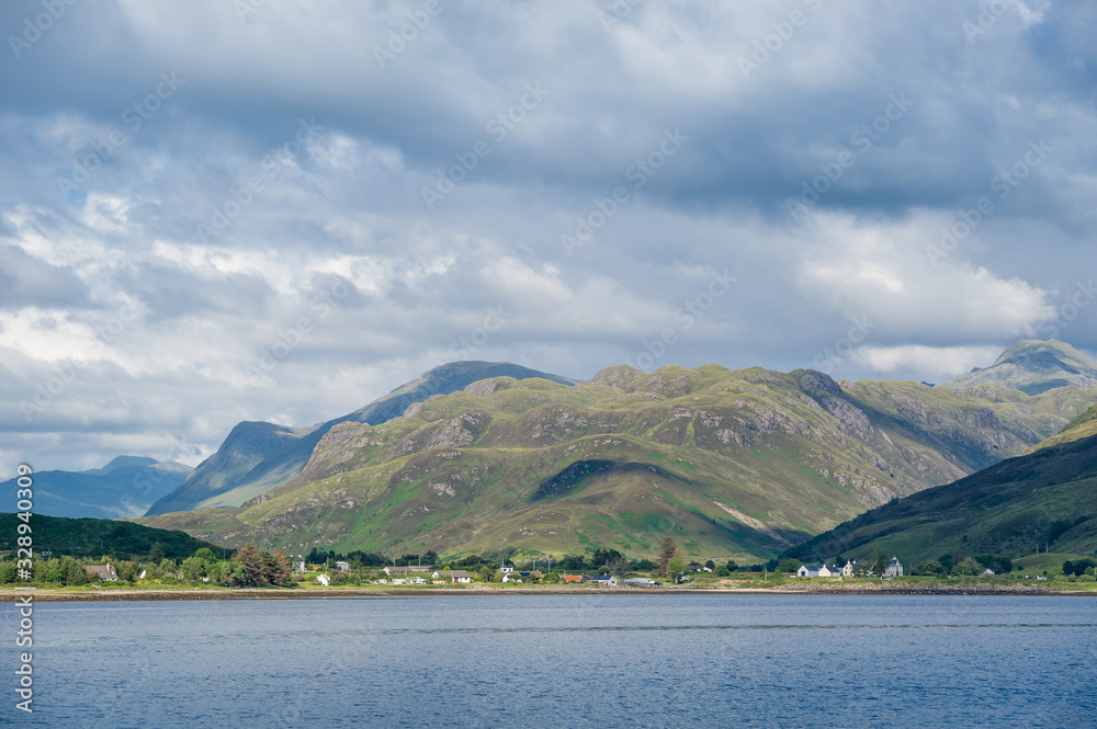Fotografie Typical scottish rural landscape from water