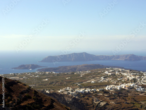 Panoramic view of Santorini island from the top of Mesa Vouno Mountain. photo