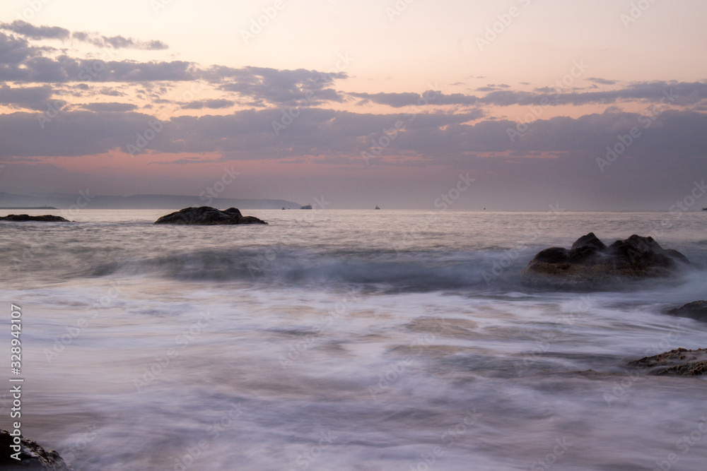 Naklejka premium cliffs and sunset view on the beach
