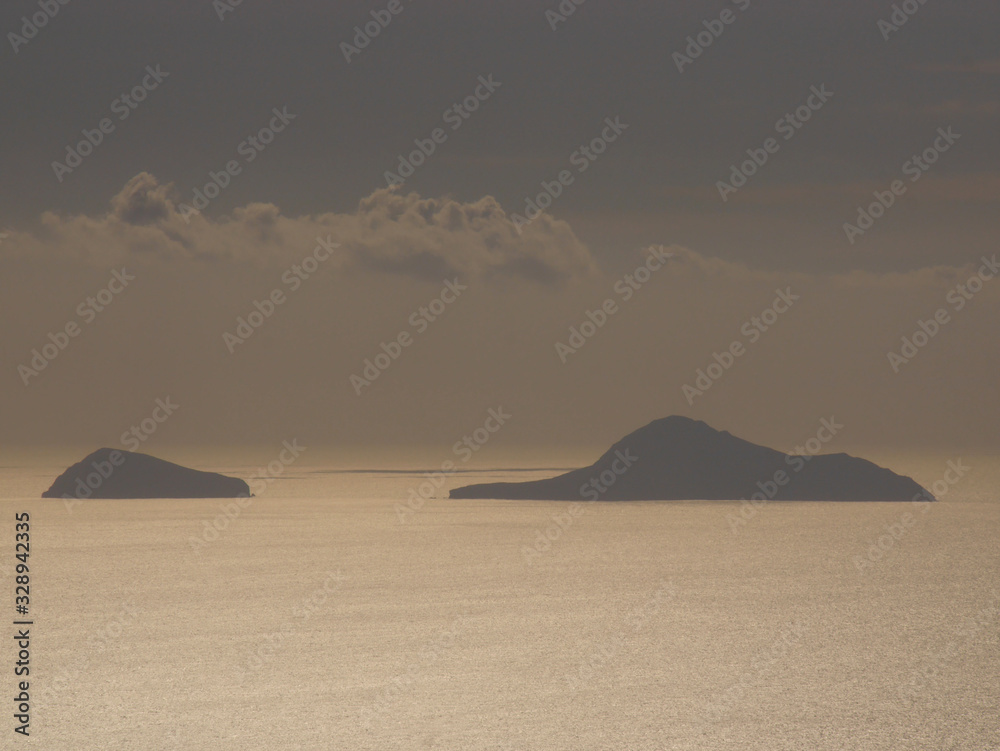 Fototapeta premium Panoramic view of the Aegean Sea and islands from the top of the mountain Mesa Vouno, on the island of Santorini, Greece.