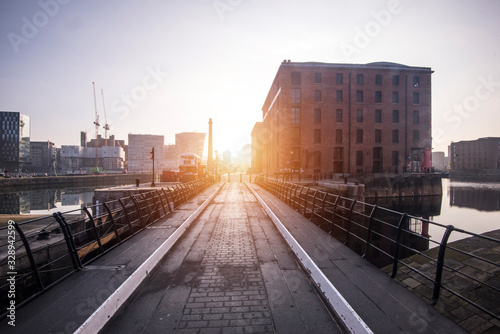 The Albert Dock area of Liverpool just after sunrise, with low sun and long shadows © mike